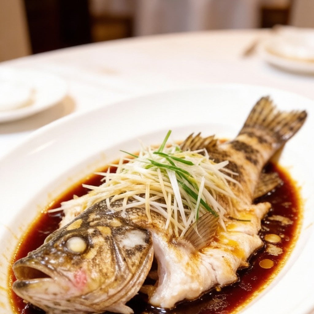 Steamed whole grouper dressed with scallion and hot soy